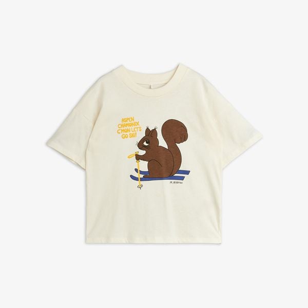 Off-white short-sleeved T-shirt featuring a Skiing squirrel print and text on the front.