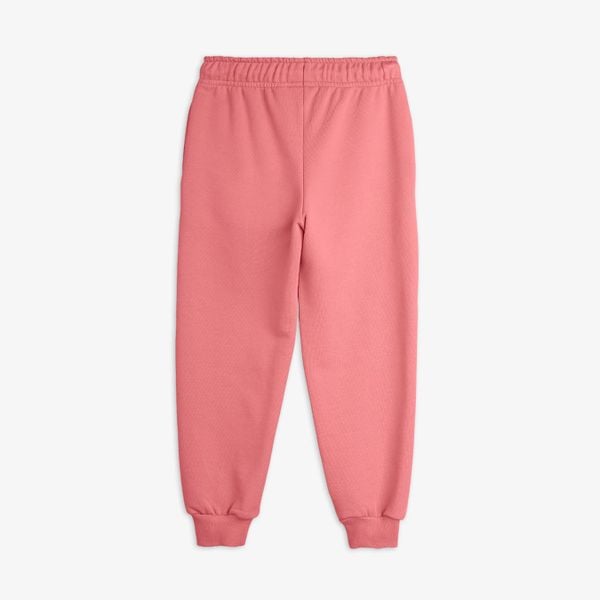 Pink sweatpants featuring an elastic drawstring waist and ribbed cuffs.