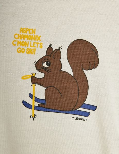 Close-up of a brown squirrel print on fabric with blue skis and yellow text saying Aspen Chamonix C'mon let's go ski!