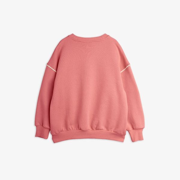 Pink crew neck sweatshirt featuring ribbed trims and piping along the shoulder seams, viewed from the back.