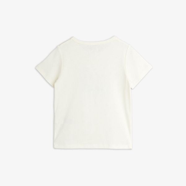Off-white short-sleeved top seen from the back.