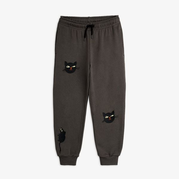 Grey sweatpants featuring embroidered cat and rat motifs and a drawstring waistband.