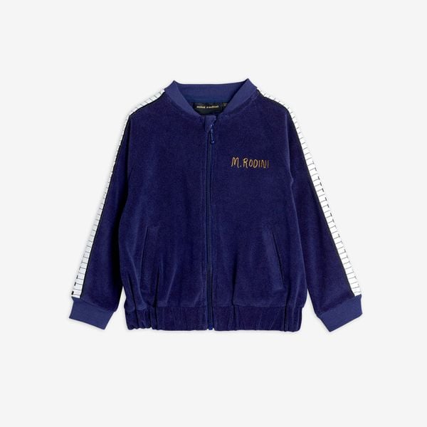 Navy terry jacket featuring piano keys tape along the sleeves, front zip, and M.Rodini embroidery on the chest.