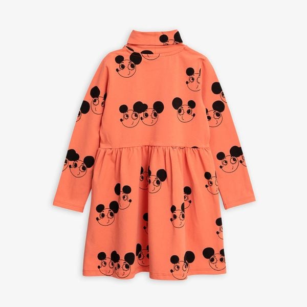 Red turtleneck dress featuring a black Ritzratz print, long sleeves, and a gathered waist.
