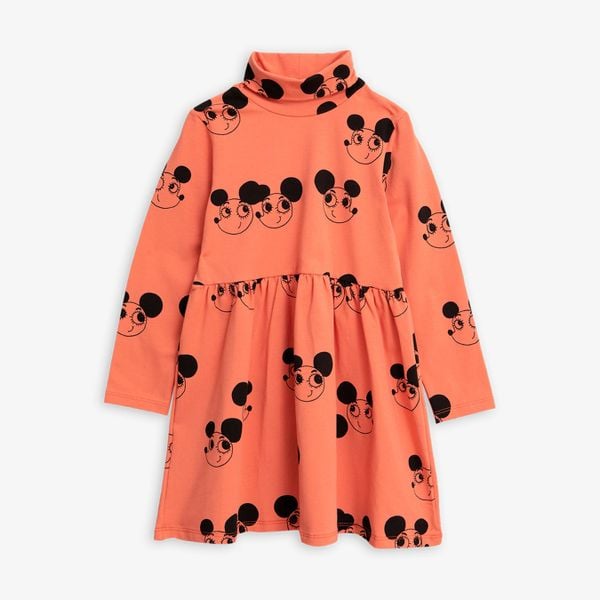 Red turtleneck dress featuring a black Ritzratz print, long sleeves, and a gathered waist.