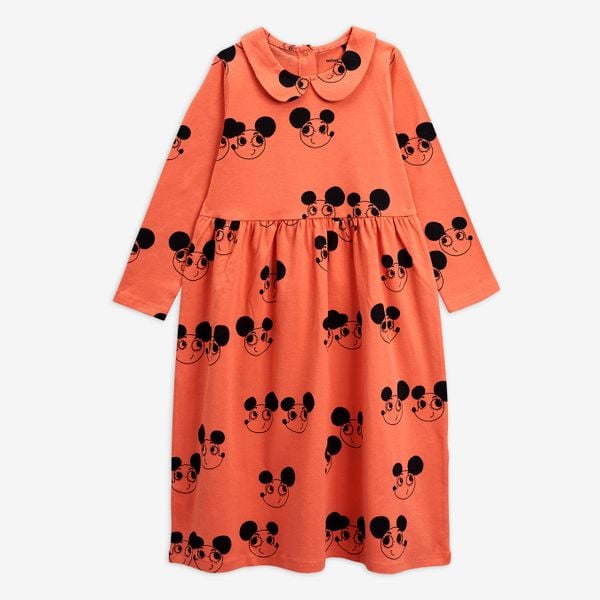Red dress featuring a rounded collar and black Ritzratz print, long sleeves, and a gathered waist.